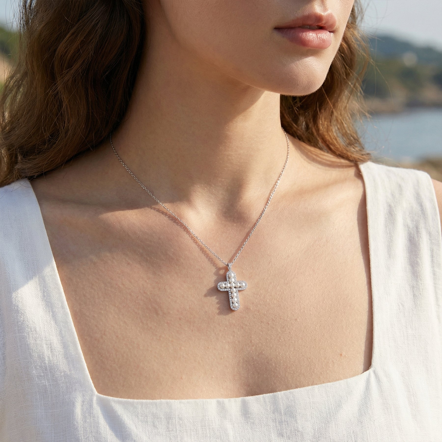 Elegant Silver Cross Necklace with Pearl and Crystal Accents