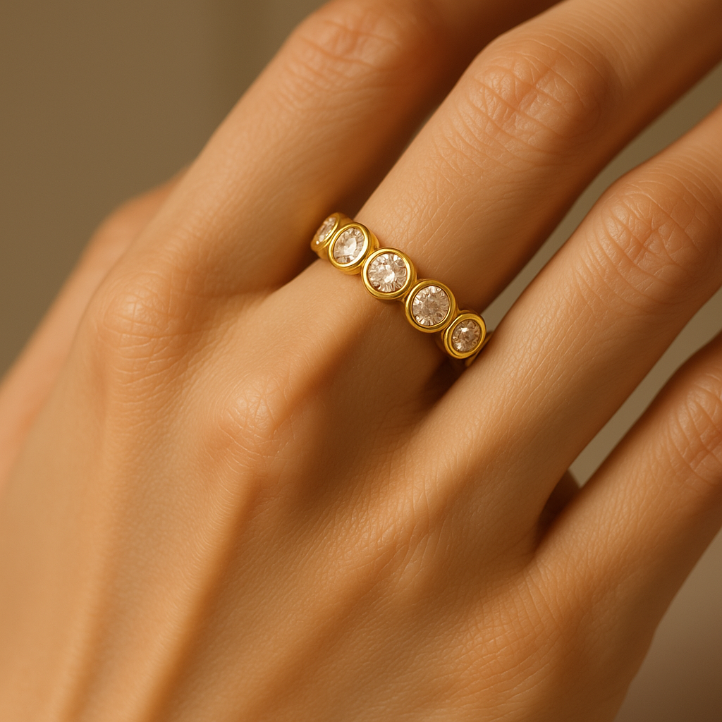 Elegant Gold Ring with Five Round Gemstones
